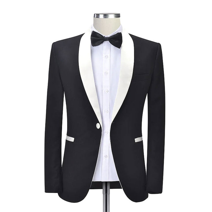 Experience the Elegance: Andre Emilio's Black Dinner Jacket Immerse yourself in the realm of sartorial excellence with Andre Emilio's black dinner jacket. Meticulously crafted with 100% wool fabric, this is more than just a piece of clothing - it's a statement of style and sophistication that transcends the ordinary. Distinctive Style The black dinner jacket with white lapel presents a unique fusion of classic elegance and contemporary flair. The solid pattern exudes a timeless appeal, while ... Formal Shawl, White Satin Fabric, Wedding Blazers, Black Dinner, Silk Pattern, Black Tux, Dinner Jacket, Tuxedo Blazer, Fabric Construction