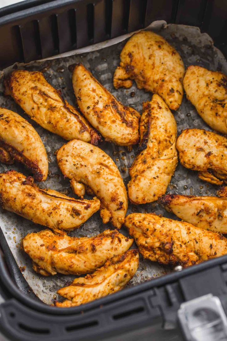 chicken wings are cooked in an air fryer and ready to be served on the grill