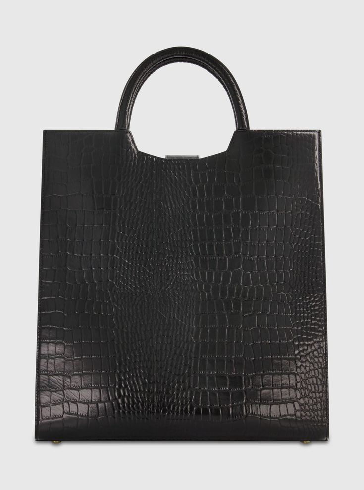 Embrace luxury with our Crocodile Leather Maxi Tote Bag. Crafted from premium leather, its spacious design offers both elegance and practicality, perfect for carrying your everyday essentials in style. Elevate your accessory game with this timeless statement piece. Mac Duggal Crocodile Embossed Leather Construction Croc-embossed and 24k Gold-plated hardware Two interior pockets Zipper closure Extra Large size: W 13.7 in x H 18.8 in x D 5.5 in (metric: 35cm X 38cm X 14cm) Microfibre faille lining Modern Formal Shoulder Bag With Crocodile Pattern, Modern Crocodile Pattern Formal Shoulder Bag, Modern Black Bags With Crocodile Pattern, Black Luxury Structured Bag, Luxury Black Structured Bag, Modern Black Shoulder Bag With Crocodile Pattern, Modern Black Crocodile Pattern Shoulder Bag, Luxury Crocodile Pattern Bags For Shopping, Black Structured Business Bag