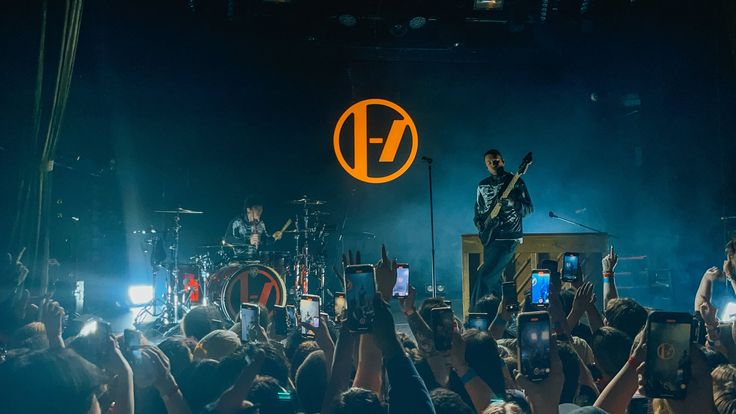 a group of people standing on top of a stage