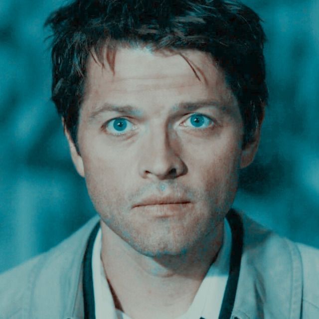 a man with blue eyes is looking at the camera