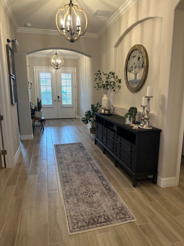 the hallway is clean and ready for us to use as an entrance way in this home