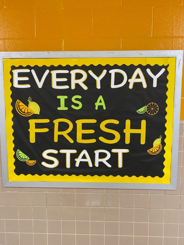 a sign that says everyday is a fresh start hanging on the wall in a bathroom