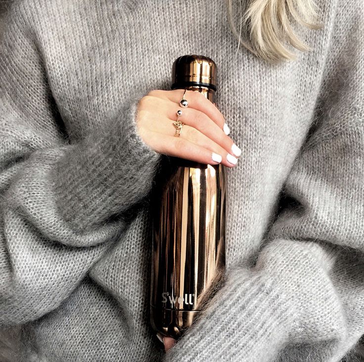 a woman with white nails holding a gold bottle in her right hand and the caption reads, hipandhealthy