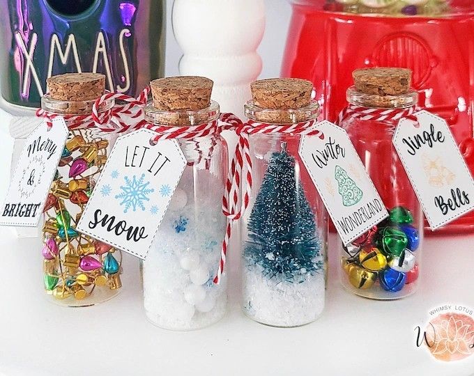 small bottles filled with different types of candies and christmas decorations on top of a table