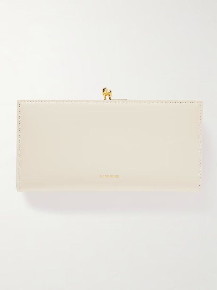 JIL SANDER Medium leather wallet | NET-A-PORTER Chic Formal Clutch With Gold-tone Logo Plaque, Elegant Everyday Wallets With Gold-tone Logo Plaque, Elegant Bifold Wallet For Office, Elegant Gold Wallets For Business, Elegant Wallets With Gold-tone Logo Plaque, Elegant Bifold Wallet With Gold-tone Logo Plaque, Modern Gold Wallets For Formal Occasions, Modern Gold Wallet For Formal Occasions, Elegant Everyday Bifold Clutch