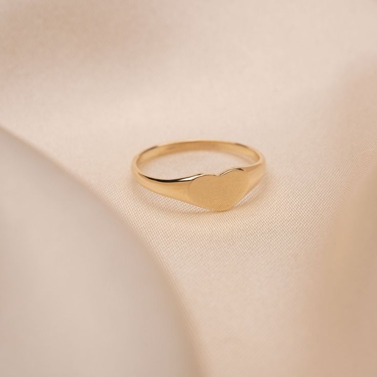 14k Solid Gold Heart Signet Ring Built to last a lifetime and more. Material: Solid 14k Gold Handmade to order. Please allow 1 - 2 weeks for processing. Dainty Initial Ring With Polished Finish, Dainty Everyday Rings Stamped 14k, Dainty Yellow Gold Signet Ring For Everyday, Dainty Everyday 14k Stamped Signet Ring, Dainty 14k Stamped Signet Ring For Everyday, Dainty Everyday Signet Ring In Recycled Gold, Everyday Dainty Signet Ring In Recycled Gold, Minimalist Heart Cut Polished Jewelry, Minimalist Heart Cut Jewelry With Polished Finish