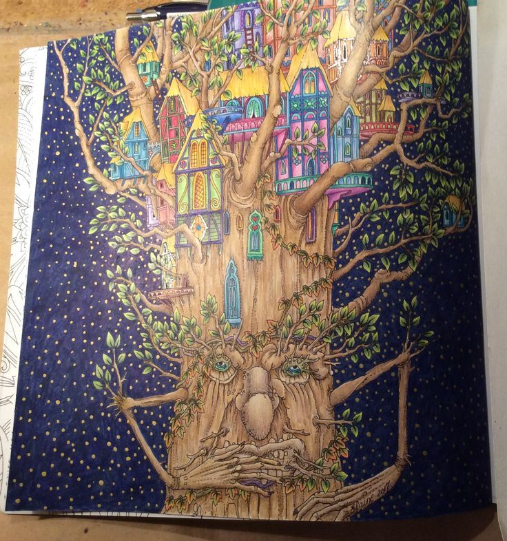 a drawing of a tree with houses on it