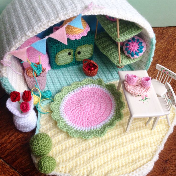 a crocheted doll house with furniture and accessories