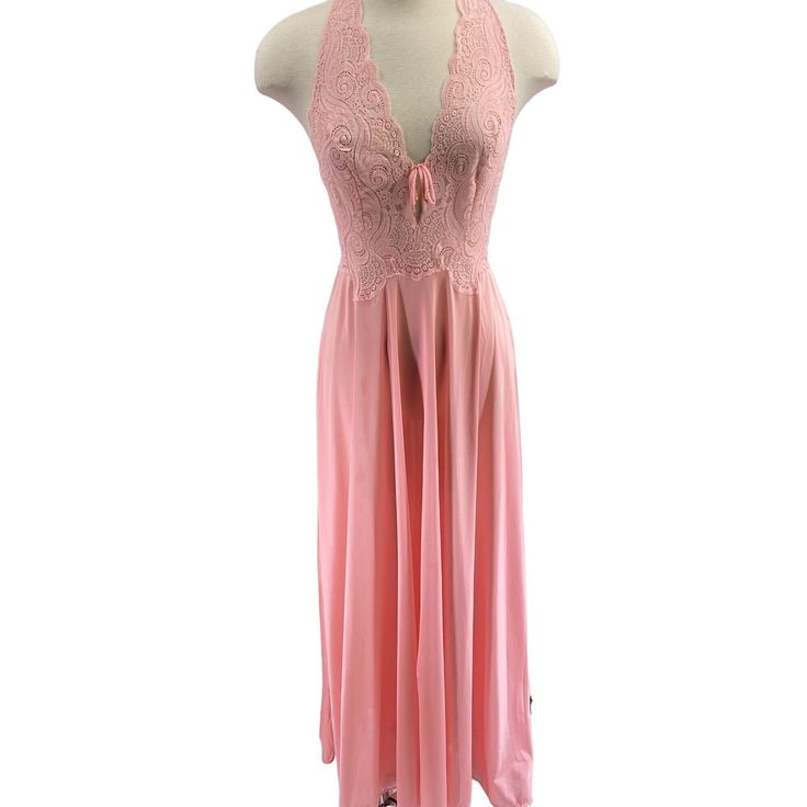 Features: * Vintage Glydons nightgown * Size M * Pink * Maxi length * Lace bodice * Nightgown * Plunging v-neck * Racer back * Elastication across the back * Keyhole in the front * Full skirt * Made in USA * Nylon Size: Womens M Measurements: Across Bust 14 in / 36 cm Length 56.5 in / 144 cm Across Waist (Stretches in the back) 12 in / 30 cm Condition: Pre-Owned Good Two small pin size holes in the skirt. See photos Pink V-neck Nightgown With Lace Trim, Pink Lace Nightgown For Loungewear, Pink Lace Nightgown With Delicate Details, Pink Sleeveless Sleepwear For Wedding Night, Pink Delicate Lace Sleepwear, Pink Sheer V-neck Sleepwear, Sheer Pink V-neck Sleepwear, Sheer Pink Nightgown For Night, Pink Lace Nightgown For Party