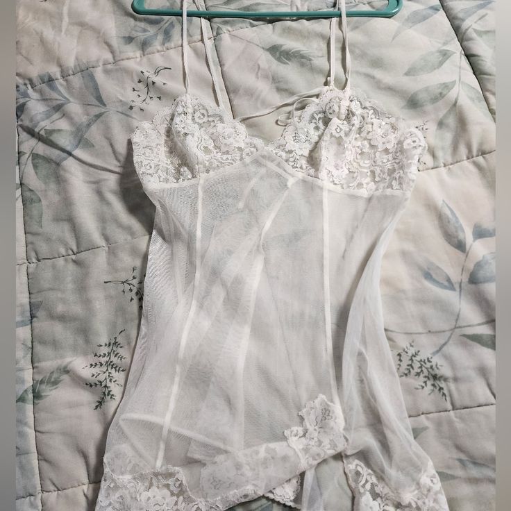 Victoria Secret Medium White Lace Negligee. Never Worn. Fitted White Camisole In Coquette Style, White Sheer Fitted Camisole, White Fitted Sheer Camisole, Victoria's Secret Lace Sleeveless Camisole, Victoria's Secret Lace Tops For Daywear, Fitted Sheer Victoria's Secret Sleepwear, Fitted Sheer Sleepwear By Victoria's Secret, Victoria's Secret Sheer Lace Sleepwear, Fitted Coquette Top By Victoria's Secret