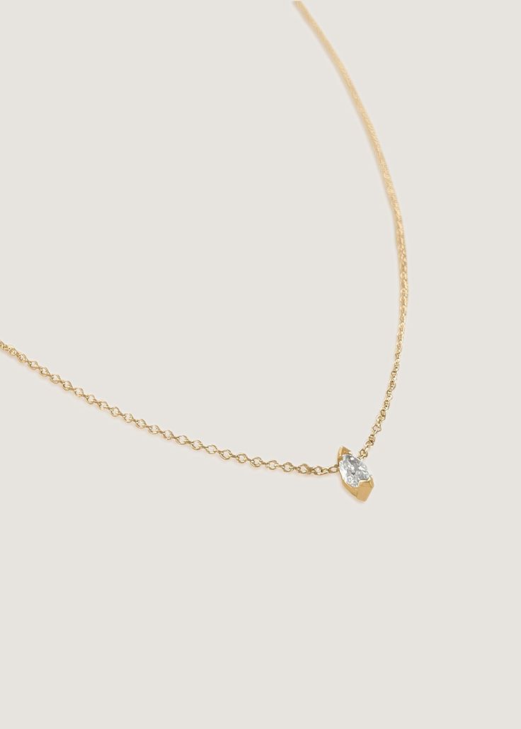 The Solitaire Marquise Diamond Necklace is an everlasting piece. Wear on its own or layer with a herringbone chain for a bolder look. The marquise diamond hangs on a Micro Rolo Link Chain. 14k solid gold—always Chain thickness: 1mm Carat weight: 0.20cw Diamond clarity: SI1 Lobster clasp closure 14k Gold Teardrop Necklace With Single Diamond, Gold Teardrop Pendant With Single Diamond, Gold Teardrop Pendant Jewelry With Single Diamond, Luxury Marquise Cut Yellow Gold Necklace, Yellow Gold Teardrop Pendant With Single Diamond, Formal Teardrop Pendant With Single Diamond, Timeless Marquise Yellow Gold Jewelry, Elegant Marquise Single Diamond Necklace, Timeless Yellow Gold Marquise Jewelry