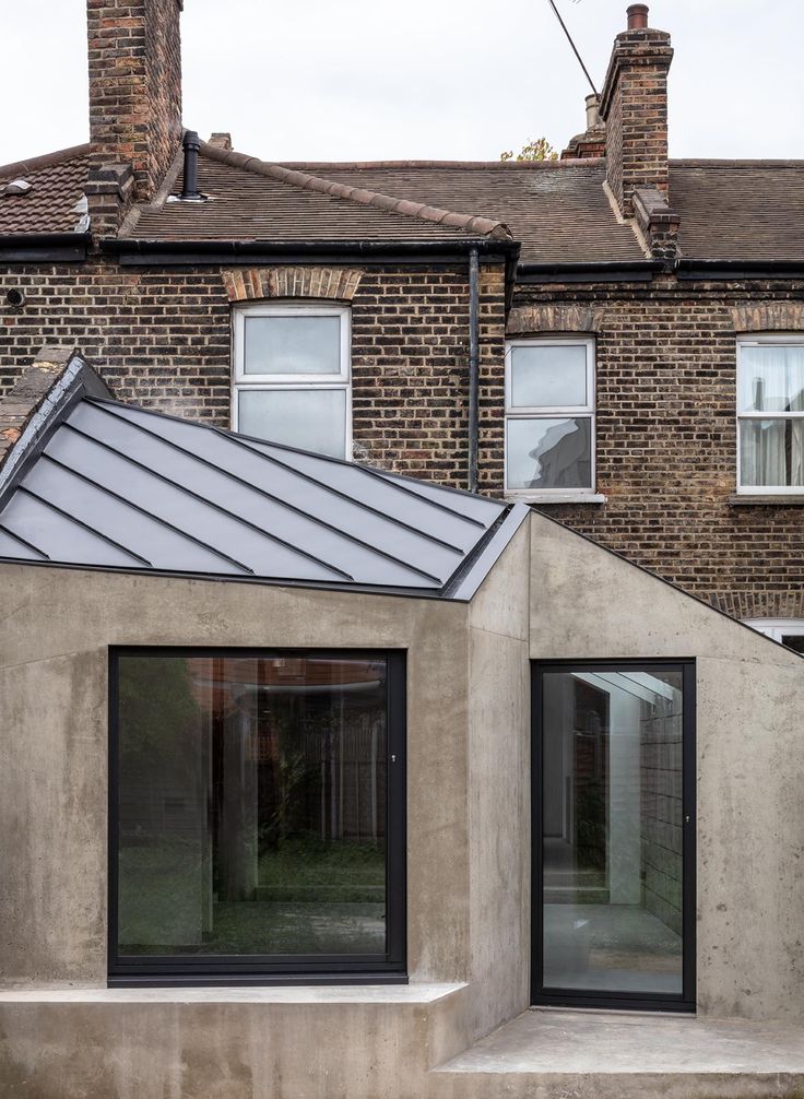 a house with two windows and a roof