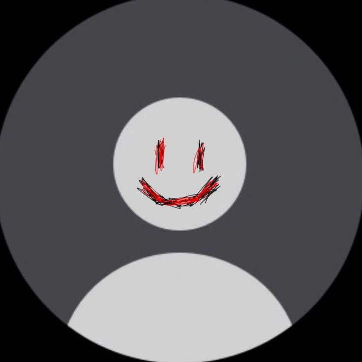 a smiley face drawn in the middle of a black and white circle with red paint on it