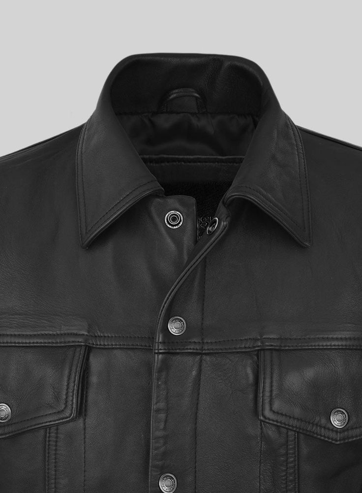 Our Maverick Trucker Leather Jacket is a must-have for those looking to make a sophisticated statement. A classic and timeless wardrobe staple, this versatile piece is crafted with the highest quality leather to ensure a unique and luxurious look.     With its rugged yet easy aura, this stylish jacket will bring cool confidence to any look for the season ahead.   Made Using Pure Napa Sheep Skin Soft Leather.   Look Includes     Black Washed and Waxed  Leather   Antique Silver Hardware     You c Leather Biker Jacket With Flap Pockets, Luxury Black Leather Jacket With Flap Pockets, Leather Biker Outerwear With Flap Pockets, Leather Jacket With Snap Buttons And Lapel Collar, Luxury Leather Biker Jacket With Pockets, Luxury Leather Jacket With Flap Pockets, Fall Leather Jacket With Snap Buttons, Rugged Leather Biker Jacket With Pockets, Rugged Leather Jacket For Workwear