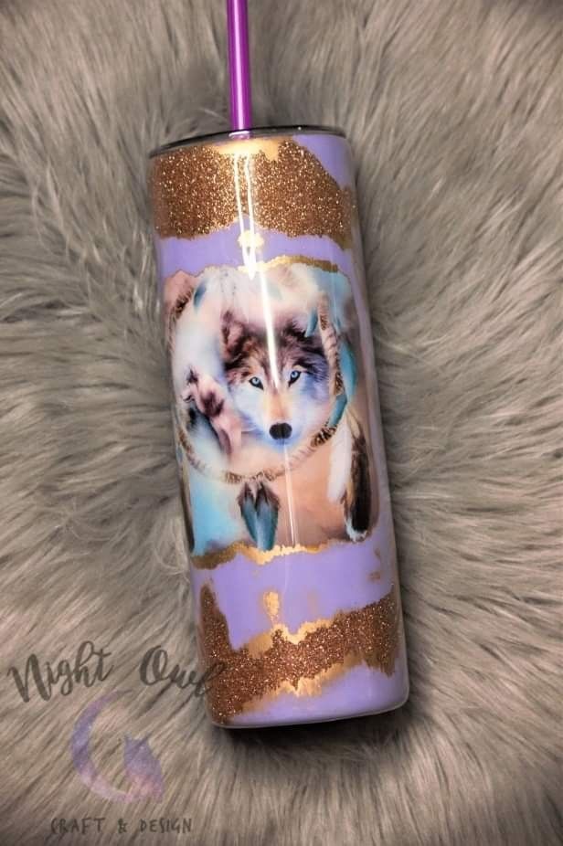 a purple and gold tumbler with an image of a husky dog on it's side