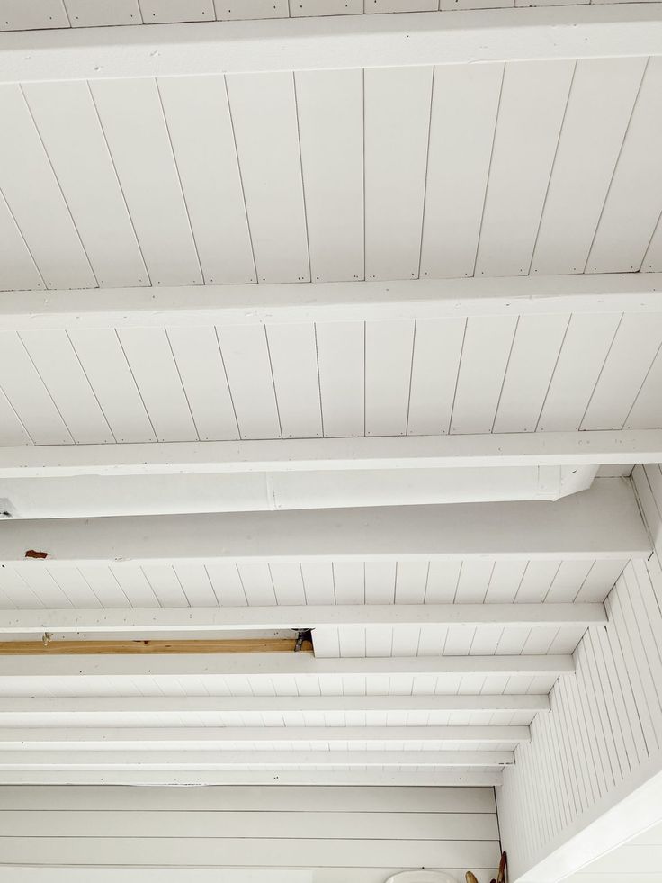 the inside of a room with white walls and ceiling