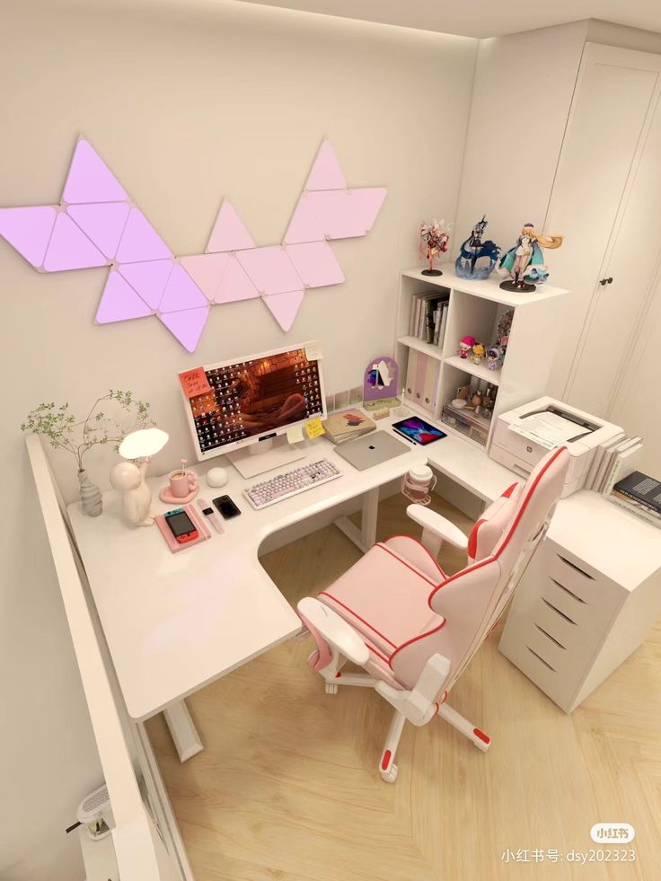 a white desk topped with a computer monitor and a pink chair next to a book shelf