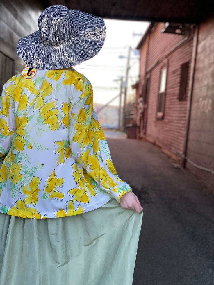 "Bright as sunshine yellow floral Vera button down blouse. All nylon ⭐️ Marked a size 14 In excellent condition with no flaws of note. Measurements Bust 40\" Length 25\" Please message me with questions before purchasing. All sales are final and ship fast from the Vermont shop. Find us on Instagram @anasclosetfullofcolor Thankyou XO" Summer Flowy Button-up Blouse, Retro Summer Blouse For Day Out, Flowy Button-up Top For Spring, Vintage Flowy Floral Print Blouse, Flowy Floral Print Vintage Blouse, Flowy Vintage Blouse With Floral Print, Yellow Button-up Blouse For Vacation, Spring Button-up Blouse For Day Out, Retro Summer Blouse With Floral Print