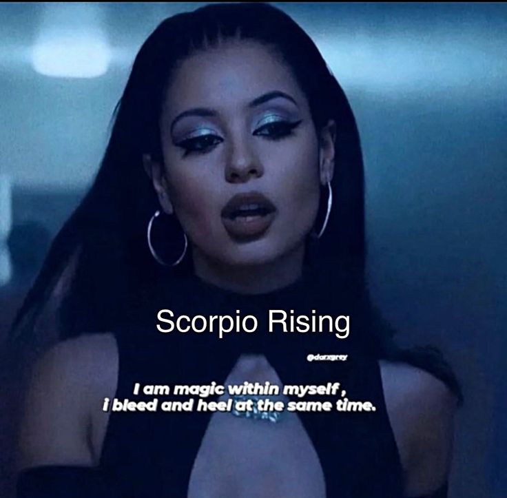 a woman with long black hair wearing large hoop earrings and an ad for scorpio rising