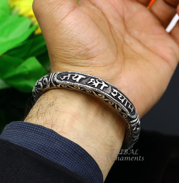 92.5% pure silver handmade excellent unisex bangle bracelet kada, amazing Divine lord Krishna "JAI SHRI SHYAMA" Mantra kada, best customized chitai work unisex personalized gift from India, Metal-925 sterling silver. Item type-Bangle bracelet. Weight-43.450 grams width-1.0 cm size- 2-6 or 6. centimeter inner diameter or 2.375"  stamped-925  Finish-oxidized. makes excellent gifting for birthday, mother's day, wedding anniversary, valentines day, Christmas day Symbolic Sterling Silver Bracelets For Festivals, Handmade Spiritual Sterling Silver Bracelet For Ceremonial Use, Spiritual Sterling Silver Bracelet For Festivals, Silver Spiritual Bracelets For Ceremonial Occasions, Handmade Sterling Silver Spiritual Bracelet For Ceremonies, Handmade Sterling Silver Spiritual Bracelet For Ceremonial Occasions, Spiritual Silver Cuff Bracelet For Festivals, Traditional Bracelet For Blessing Occasions, Symbolic Silver Bracelets For Festivals