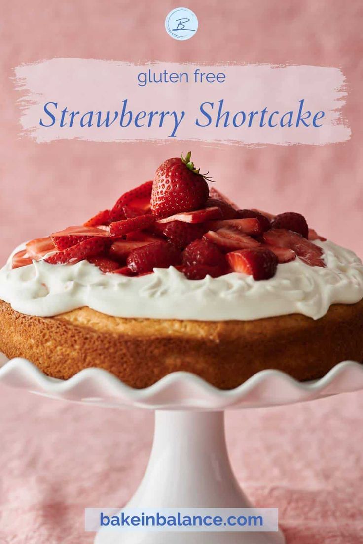 a strawberry shortcake on a white cake plate with the words gluten free strawberry shortcake