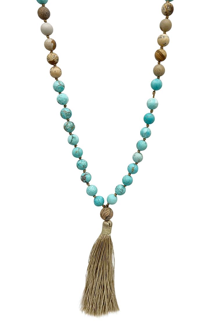 Show off boho-chic style in this long necklace composed of mixed beads in earthy hues with a tassel pendant. 38" length; 3 1/2" pendant 14k-gold plated brass/glass Imported Adjustable Bohemian Long Necklace With Tassels, Bohemian Long Necklace With Tassels, Spiritual Beaded Tassel Necklace For Beach, Adjustable Turquoise Tassel Necklaces, Beaded Tassel Necklace With Round Beads For Beach, Bohemian Tassel Necklace With Dangling Beads For Beach, Adjustable Long Tassel Necklace With Dangling Beads, Adjustable Beaded Long Tassel Necklace, Bohemian Long Tassel Necklace With Dangling Beads