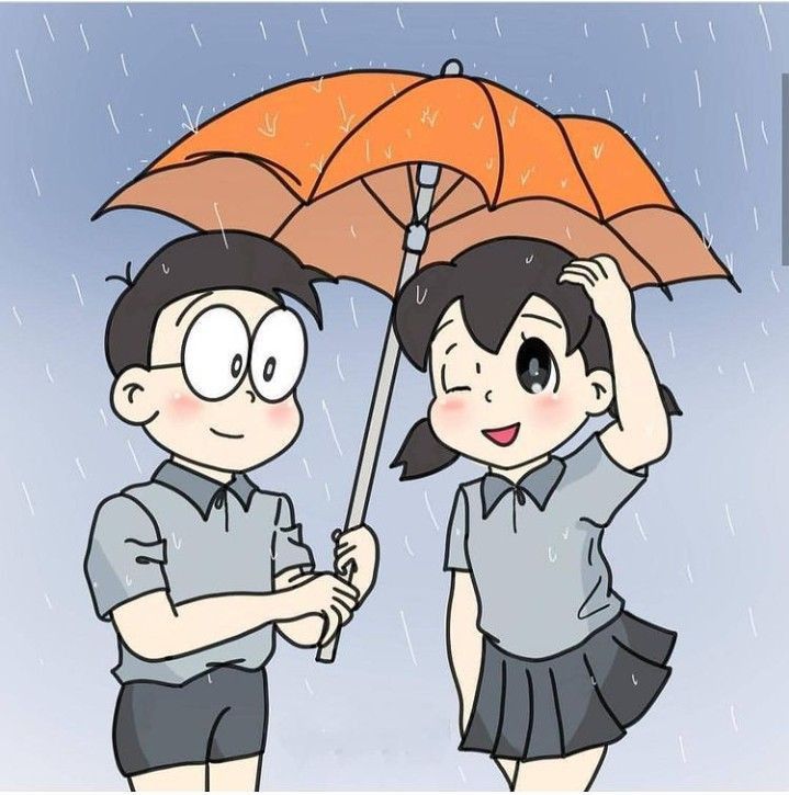 two people standing under an umbrella in the rain