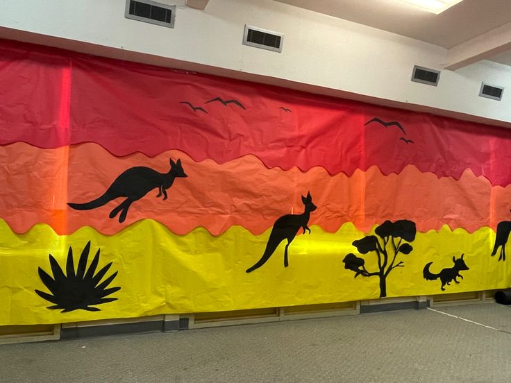 an animal themed classroom wall with kangaroos and sunflowers on it's side