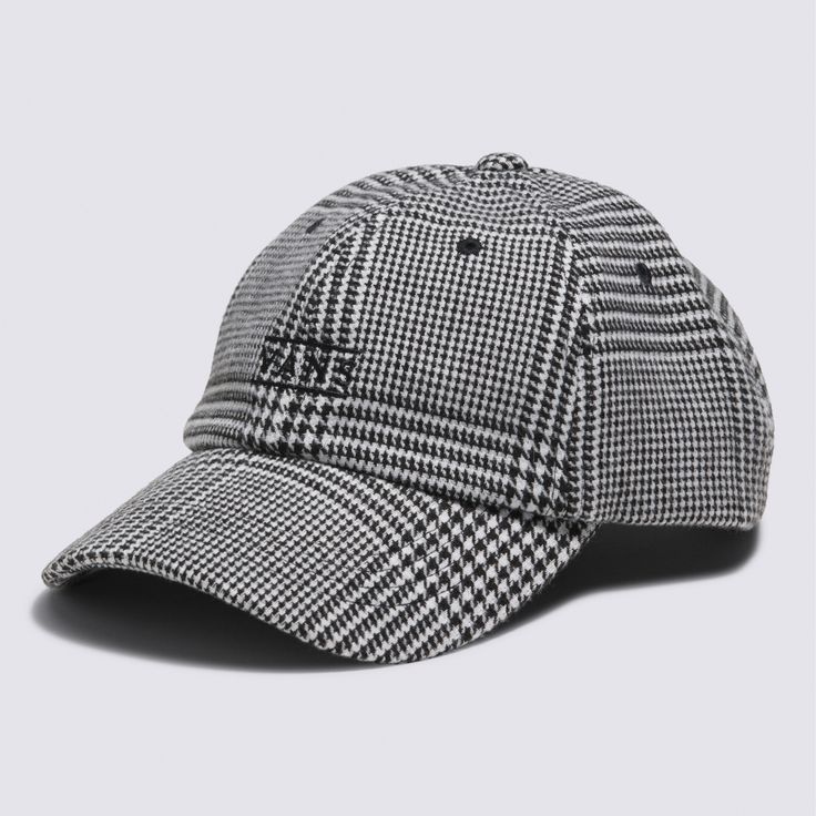 a black and white checkered baseball cap on a gray background with the word,