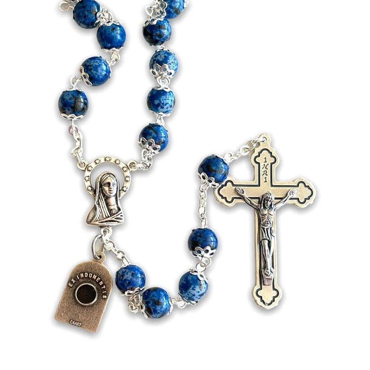 Saint Padre Pio blue resin rosary with relic ex-indumentis Small and light rosary, perfect gift for Holy Communion or Confirmation. The double capping adds elegance to the colorful beads. Attached to this pretty rosary there is a small medal of St. Pio with a relic ex-indumentis in the back. The beads are very pretty and light. The rosary is very nice to the touch and easy to bring always with you. You are purchasing the rosary; the relic medal is my FREE GIFT. Padre Pio Prayer, Baptism Favors Girl, St Michael Medal, Blue Rosary, Mini Rosaries, Personalized Rosary, Rosary Gift, First Communion Favors, Rosary Beads Catholic