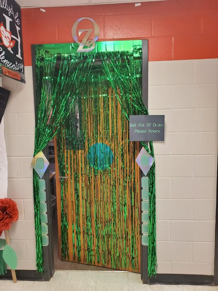 a door decorated with green and gold streamers