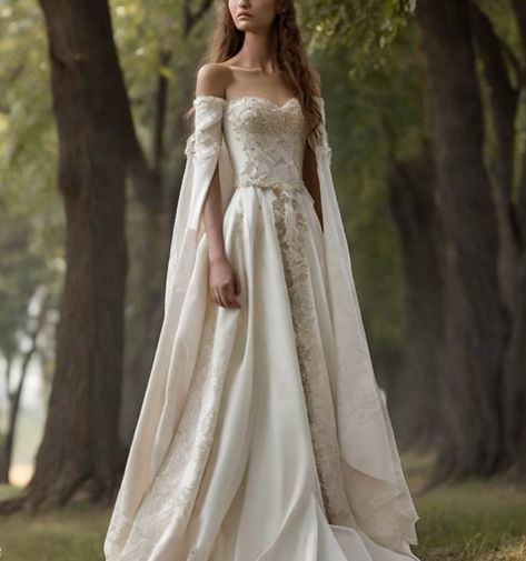 a woman in a wedding dress standing on the side of a road with trees behind her