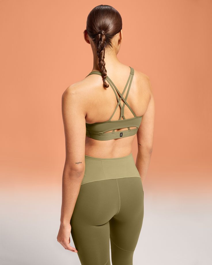 Made for low-impact workouts, flow into every movement with this buttery-soft, lightly padded sports bra. Made with moisture-wicking materials and a strappy open back for increased ventilation. The power mesh liner also keeps sweat out, so you can focus on your movement. Move freely, thanks to the open back design and gentle elastic underband. So you can bend and breathe in any direction. It's so lightweight, it's off your mind. Ultra-soft cups and soft, supple fabrics create a bra you'll want t Soft Workout, Sports Bra Design, Support Design, Strappy Sports Bras, Padded Sports Bra, Low Impact Workout, Sport Bh, Back Design, Moisture Wicking Fabric