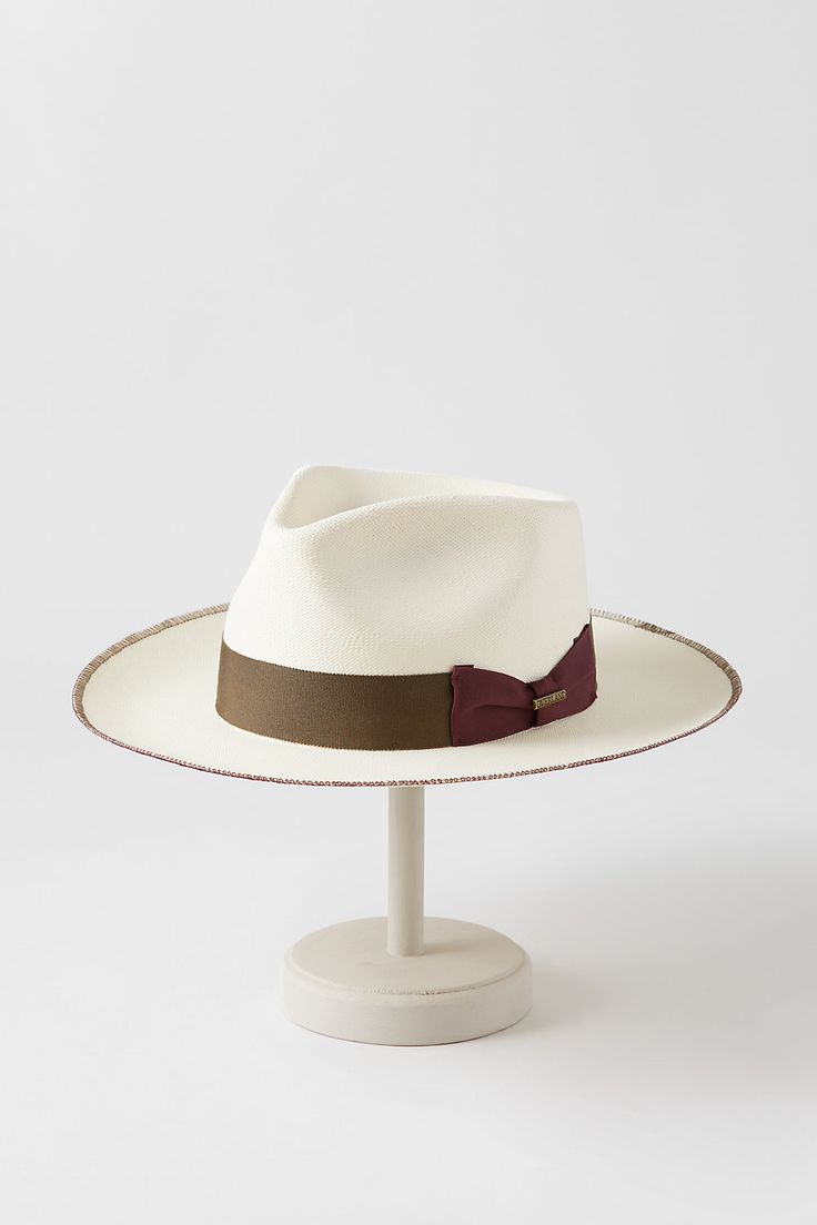 Light and airy, our Monty shantung straw fedora is crafted in the United States to help you keep your cool under the scorching sun. Monty is fully equipped to shield you from intense rays, and its generous brim with whipstitch accents, grosgrain ribbon and bow hatband, and impressive teardrop crown uphold the longstanding tradition of fine hat making. Luxury Fedora Straw Hat For Beach, Luxury Fedora Straw Hat For The Beach, Luxury Straw Hat With Short Brim For Beach, Luxury Wide Brim Fedora For Beach, Luxury Wide Brim Fedora For The Beach, Luxury Short Brim Straw Hat For The Beach, Luxury Short Brim Straw Hat For Beach, Luxury Brimmed Summer Hats, Luxury Summer Hat With Curved Brim