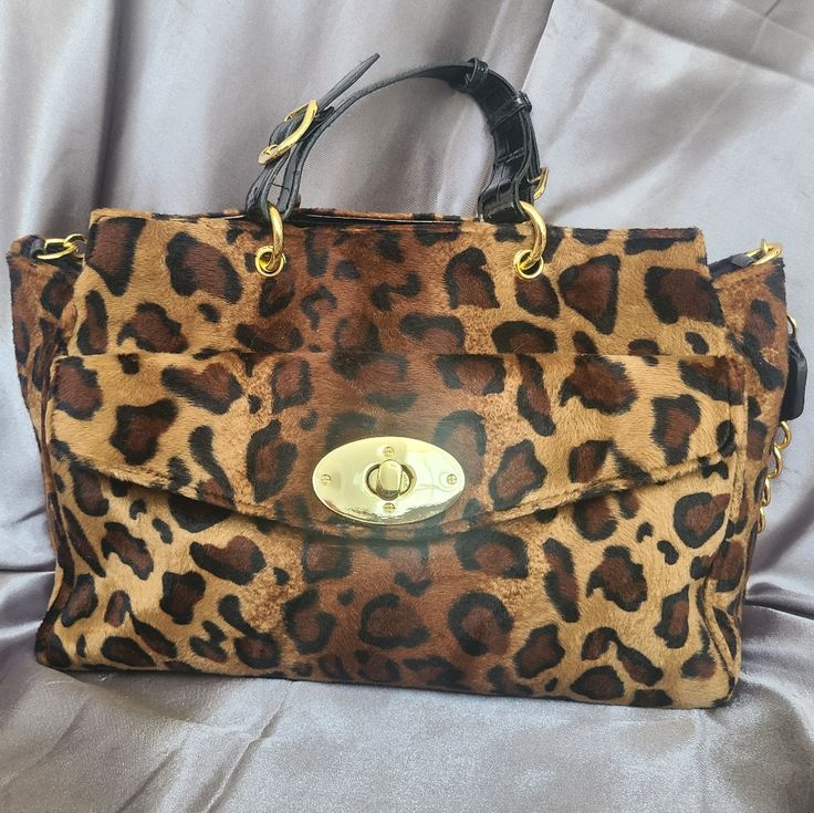 Velvety Smooth Janie Bryant Leopard Print Handbag With Large Front Pocket. Gold Polished Hardware And Black Patent Leather Handles. One Gold Chained/Patent Leather Shoulder Strap. Interior Slip Pockets And Zipper Pocket. Never Used. Fur Bags, Leopard Print Handbags, Leopard Handbag, Leopard Print Bag, Leopard Bag, Leather Tote Bag Women, Dooney & Bourke Bag, Animal Fur, Fur Bag