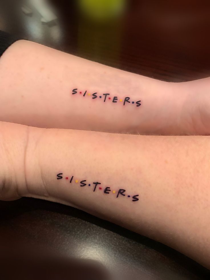 two tattoos that say sisters on their arms