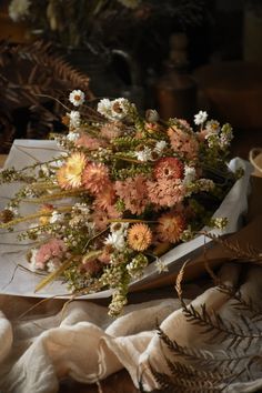 a bouquet of flowers sitting on top of a table