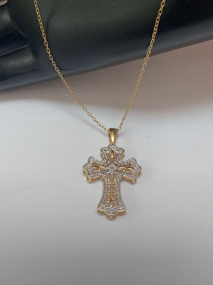 This beautifully highly detailed made pendant features a cross with small diamond as a centerpiece. Made from gold over sterling silver/vermeil. On a 17 Inch long chain. Both are marked JCM .925 - and the pendant is also marked Thailand In excellent vintage condition with some signs of wear, minor scuffs, marked and tested Sterling Silver .925. Also the diamond was tested, not sure if it is natural or lab. created! PLEASE look at ALL pictures for measurements and condition as they are a very important part of the description, and what you will receive! Pictures are made with different light! Please note that this is sold "As Is", no returns please! The Link to my shop is: https://www.etsy.com/shop/MyWildWork Spiritual Cross Pendant Jewelry For Mother's Day, Personalized Spiritual Cross Pendant Jewelry, White Gold Cross Charms For Anniversary, Sterling Silver Cross Charms For Anniversary, Sterling Silver Cross Jewelry For Anniversary, Sterling Silver Cross For Anniversary, Gold Jewelry With Diamond Accents For Mother's Day, Mother's Day Gold Jewelry With Diamond Accents, Mother's Day Cross Pendant Jewelry