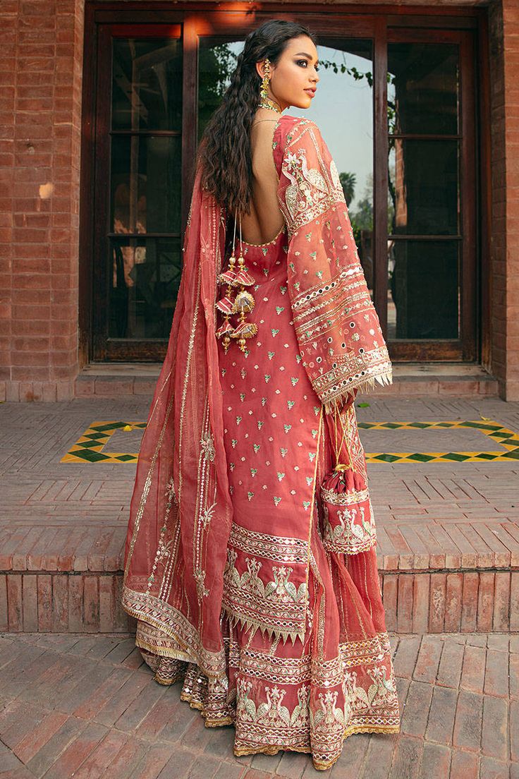 Embroidered Organza Sharara Kameez Pakistani Eid Dress is an epitome of royalty and elegance that wins everyone's hearts at the very first glance. Premium fabric and lavish designs on this stunning attire make it your foremost priority for the festive occasion. Kameez: The beautiful kameez in an alluring coral pink shade comes in premium organza fabric. Hand-crafted embellishments of embroidery and floral designs make this organza kameez a perfect choice to pair with Sharara. Shimmering details, Organza Sharara, Eid Dress, Pakistani Wedding Outfits, Desi Fashion Casual, Pakistani Fancy Dresses, Pakistani Fashion Party Wear, Beautiful Pakistani Dresses, Indian Dresses Traditional, Traditional Indian Outfits