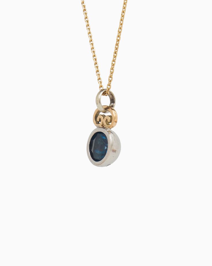 The Blue Moon Pendant combines simplicity with distinctive elegance. It showcases a delicate design, featuring a faceted London blue topaz stone set in sterling silver, complemented by a 14K gold petroglyph detail at the top. Pair with your favorite chain, sold separately. Metal: Sterling silver with 14K gold accent Stone: London blue topaz Dimensions: 18mm x 10mm Style #: P113Lb Modern Topaz Birthstone Jewelry, Timeless Topaz Jewelry Gift, Modern White Gold Topaz Jewelry, Modern Yellow Gold Jewelry With Blue Topaz, Oval Topaz Birthstone Jewelry, Modern Yellow Gold Blue Topaz Jewelry, Elegant Topaz Jewelry With Polished Finish, Fine Jewelry In Polished Topaz, Fine Jewelry With Polished Topaz