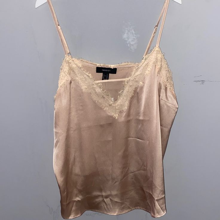 Great Condition / Still With Tag! Never Worn, Cute Satin Champagne Tank Top With Lace Trim On Top. Forever 21 Plus Forever 21 Camisole For Night Out, Chic Forever 21 Camisole Top, Forever 21 Sleeveless Spring Camisole, Green Cami, Top With Lace Trim, Fitted Forever 21 Camisole Tank Top, Tank Top With Lace, Mint Green Tops, Black Lace Cami