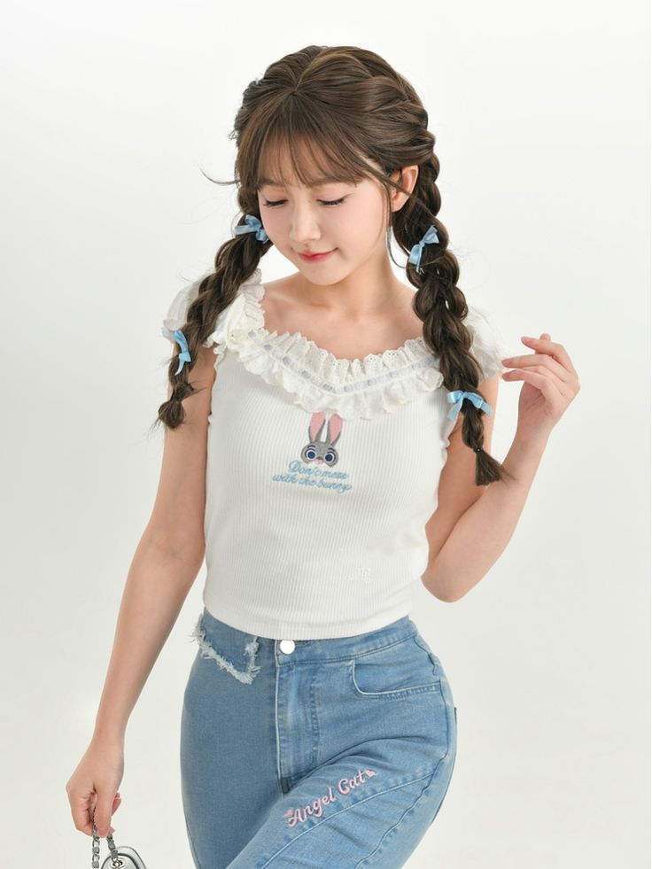 This charming top features a delightful Judy embroidery from the popular movie Zootopia, adding a touch of whimsy to your outfit. The delicate lace collar adds a sweet and feminine touch, perfect for adding a hint of romance to your look. This top is a versatile piece that can be paired with a variety of bottoms to create different looks.   Please note that this product includes only the top, other items shown are for styling purposes and can be purchased separately.  Garment Size   	 		 			Size Cute White Top With Lace Collar, Cute White Tops With Lace Collar, Cute Tops With Doll Collar For Spring, Cute Tops With Ruffled Collar, White Tops With Cute Collar In Feminine Style, White Feminine Top With Cute Collar, Cute Spring Tops With Collar, Cute Sleeveless Top With Lace Trim, Feminine White Top With Cute Collar