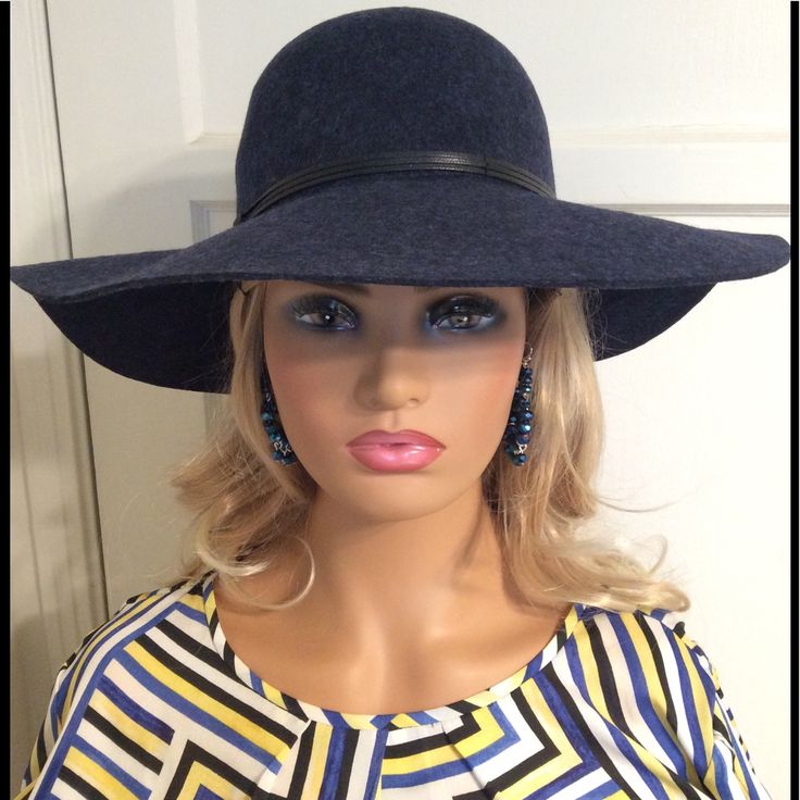 Wear This New Elegant Navy Blue Hat To Add To Your Sophisticated Look. This Hat Is A Great Accessory To Complete Your Put Together Fashionable Style. It Goes Well With All Black Or Or A Blue Or Red Top/Dress. Make Sure You Wear Your Over The Knee Boots To Really Look Like The Model You Are. Earrings Not Included. Navy Hat For Spring, Blue Spring Felt Hat With Curved Brim, Elegant Navy Wide Brim Hat, Blue Felt Hat With Flat Brim For Spring, Blue Flat Brim Felt Hat For Spring, Classic Blue Wide Brim Felt Hat, Chic Blue Adjustable Hat, Blue Wide Brim Cloche Hat For Spring, Chic Adjustable Blue Hat