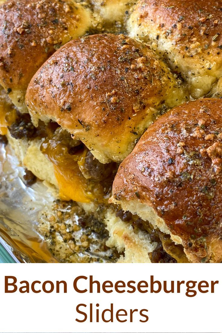 bacon cheeseburger sliders with melted cheese and onions on them in a casserole dish