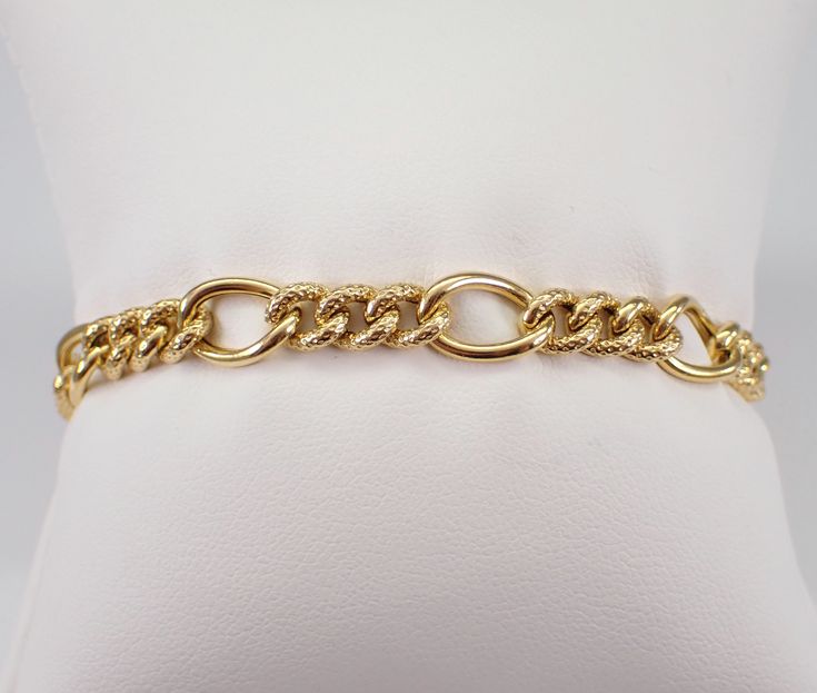 "Vintage Estate 14K Yellow Gold Link Bracelet. This bracelet weighs 7.5 grams, measures 7.5 mm in width and 7 1/4\" in length. This bracelet is traditionally called a textured Figaro Link but can be used for a charm bracelet.   I will ship this bracelet promptly in a gift box.  ADDITIONAL REQUESTS If you would like to see more pictures of this item, please let us know and we would be happy to provide them for you. Please contact us with all questions, we are here to help." Luxury Figaro Chain Bracelet For Formal Occasions, Heirloom Yellow Gold Oval Link Bracelets, Luxury Formal Figaro Chain Bracelet, Heirloom Yellow Gold Oval Link Bracelet, Formal Chain Bracelet, Formal Heirloom Yellow Gold Chain Bracelet, Formal Heirloom Jubilee Chain Bracelet, Elegant Formal Bracelet With Figaro Chain, Classic Bangle Charm Bracelet For Formal Occasions