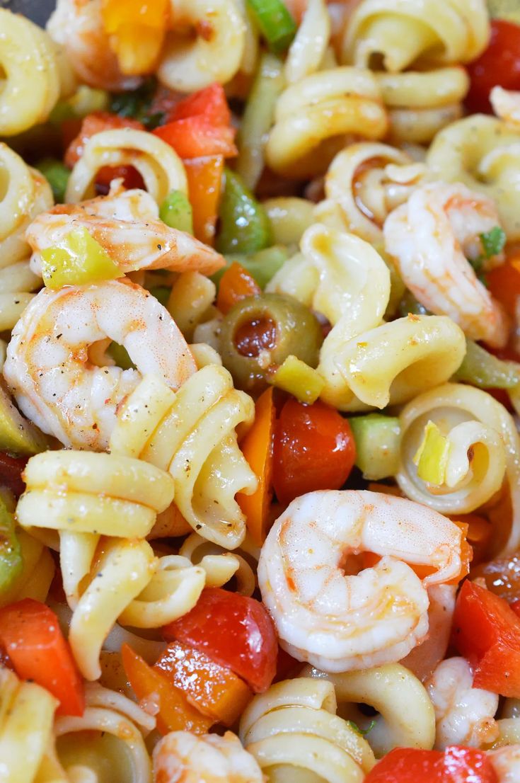 pasta salad with shrimp and peppers in a bowl