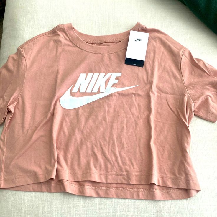 Nwt Nike Crop T-Shirt - Pink / Peachy New. Great For Workouts Or Athleisure Casual Cropped Crew Neck T-shirt For Workout, Spring Sports Cropped Crew Neck T-shirt, Spring Cropped T-shirt For Sports With Short Sleeves, Spring Cropped T-shirt With Short Sleeves For Sports, Spring Cropped Crew Neck T-shirt For Workout, Summer Workout Tops With Logo Print, Summer Workout Top With Logo Print, Casual Cropped T-shirt For Summer Workout, Nike Summer Workout T-shirt