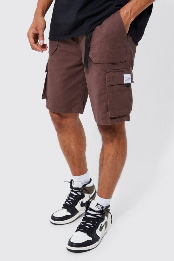 If it's comfort that you're looking for in men's holiday fashion, pick a pair of shorts. You haven't been skipping leg day, have you? No, we know you wouldn't. All the better as you'll want to sport some of our stylish denim shorts, chino shorts, jersey shorts or cargo shorts. If you're looking for new outfit ideas for this summer, consider pairing a horizontal striped t-shirt with jean shorts, or opt for a printed shirt and chino shorts for a smarter combo. Round off with a pair of sliders or loafers, for extra style points.Style: Cargo ShortsDesign: PlainFabric: CottonDetail: Woven TabLength: Mid New Outfit Ideas, Khaki Cargo Shorts, Going Out Trousers, Gym Hoodie, Cargo Short, Tall Pants, Lunch Date, Cargo Shorts Men, Mens Cargo