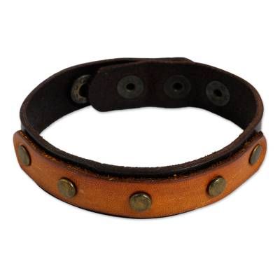 Ruggedly chic this stylish leather bracelet features leather in contrasting dark and light brown shades punctuated by antiqued brass studs. It can be closed at one of 3 lengths with brass snaps for a comfortable fit. Light Brown Shades, Upcycled Handbag, Rustic Bracelet, Leather Bracers, Ear Cuff Jewelry, Best Tan, Cotton Handbag, Brown Leather Bracelet, Stylish Bracelet